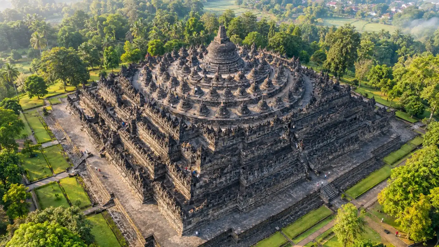 Borobudur seen from above, its square mandala plan ringed by circles of stupas